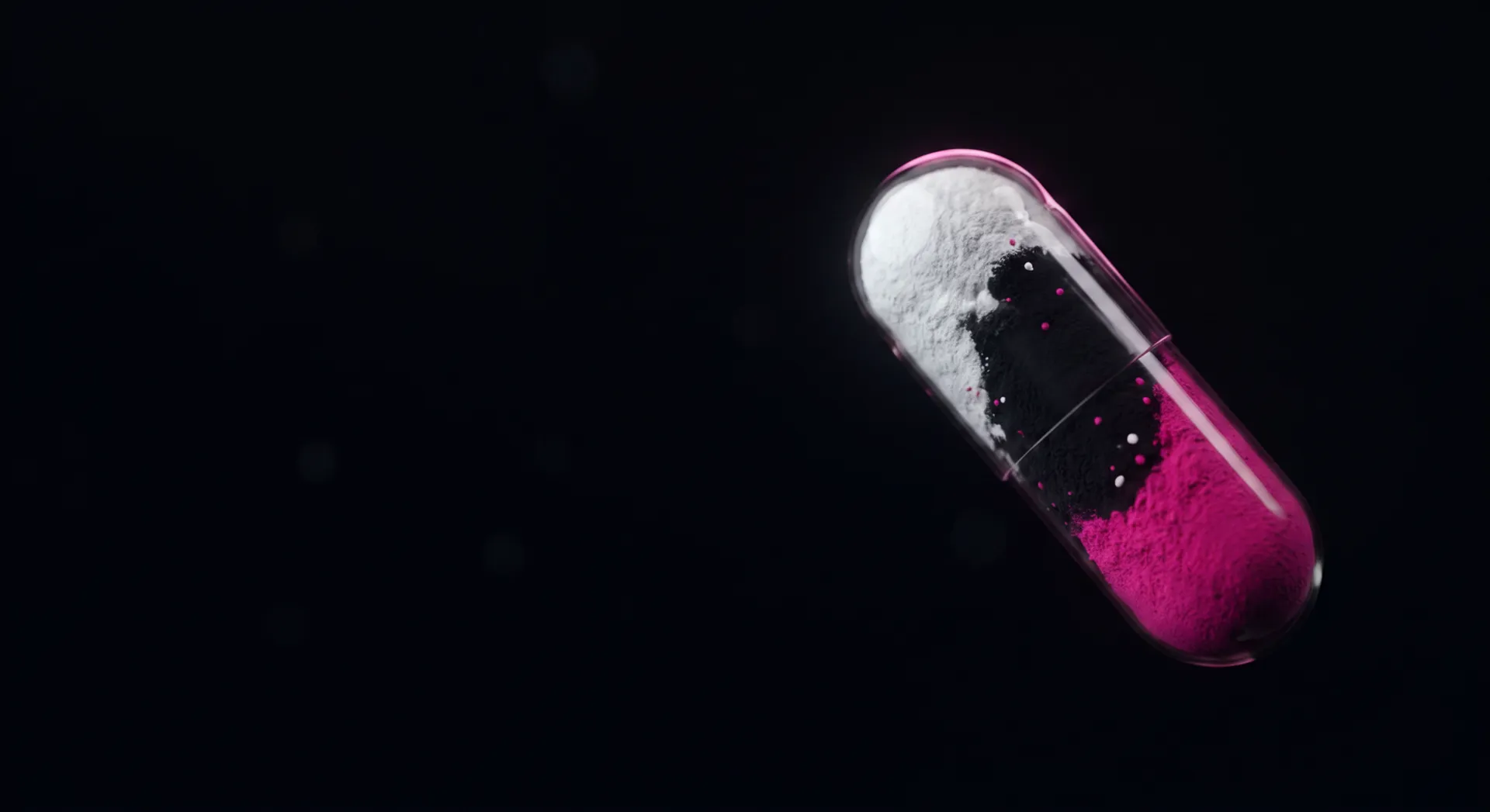 The FamePill capsule — white, black and magenta powder inside a translucent pill